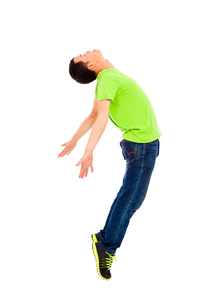 istock young man jumping and spread his body 491446455
