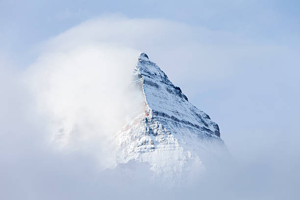 istock Pyramid Shaped Mount Assiniboine in the Fog 491446594