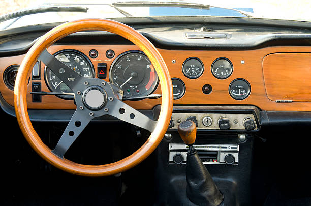 wooden dashboard of a vintage car stock photo