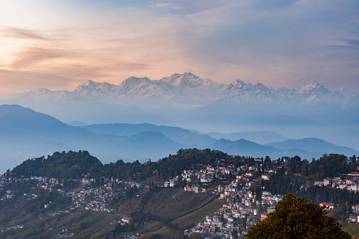 Kanchenjunga range peak after sunset with Darjeeling town in the foreground , Sikkim, India.