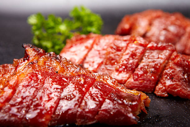 Chinese BBQ Pork Chinese BBQ Pork, close up barbecue pork stock pictures, royalty-free photos & images