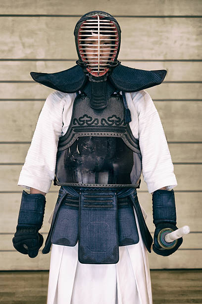 Kendo fighter in traditional gear Kendo fighter in traditional gear kendo stock pictures, royalty-free photos & images