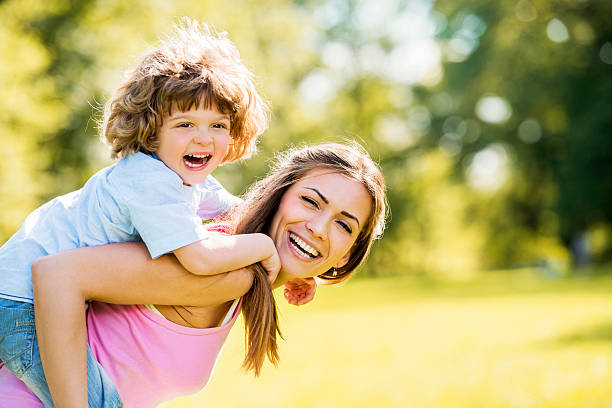 istock Mother piggybacking her son. 491448245