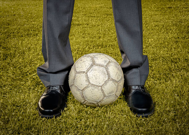 istock Businessman playing with soccer ball - retro-style 491448349