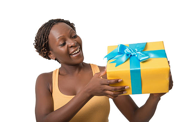 istock Beautiful surprised african woman holding gift 491449882