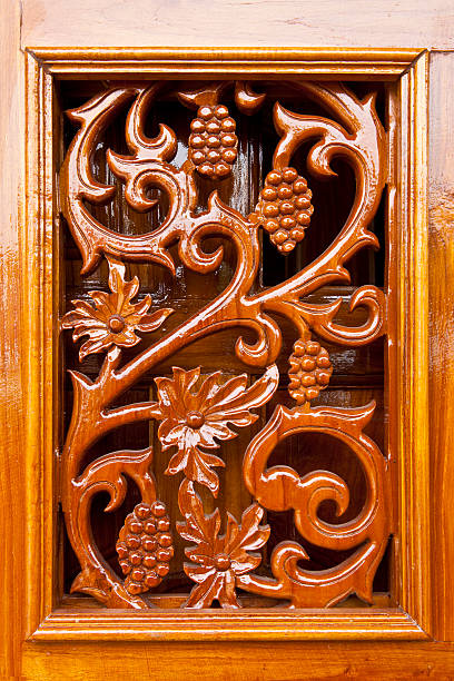 istock Thai plant carved pattern on lacquer wooden door 491450025