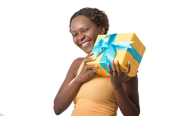 istock African woman holding a gift box 491450036