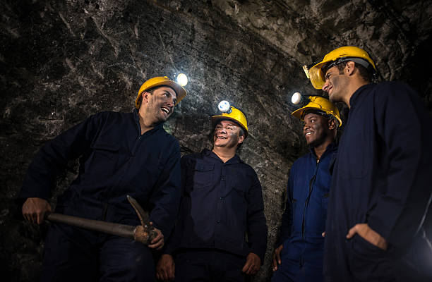istock Group of miners working at the mine 491451002