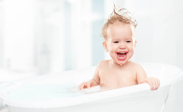 istock happy funny  baby  laughing and bathed in bath 491451865