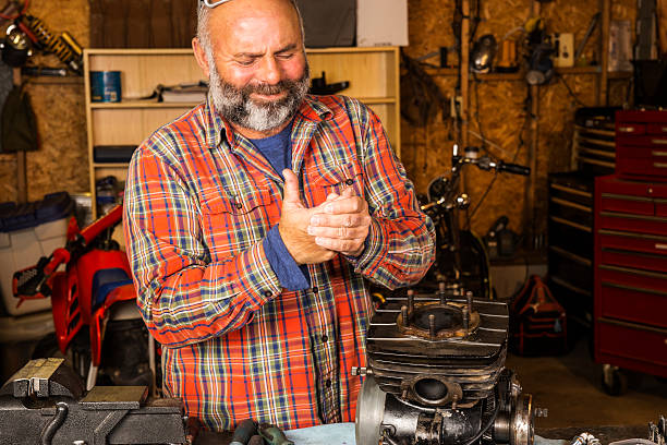 istock Man in a workshop with a hand injury 491465368