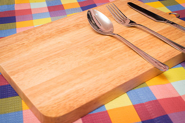 istock Fork, Knife and Table Cloth on wooden background. 491465542