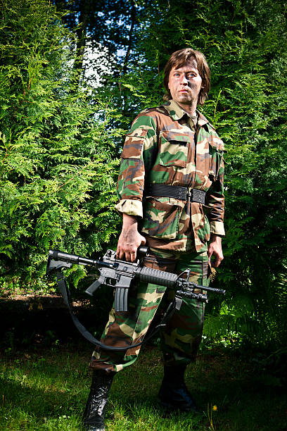 istock soldier holding the gun 491466384