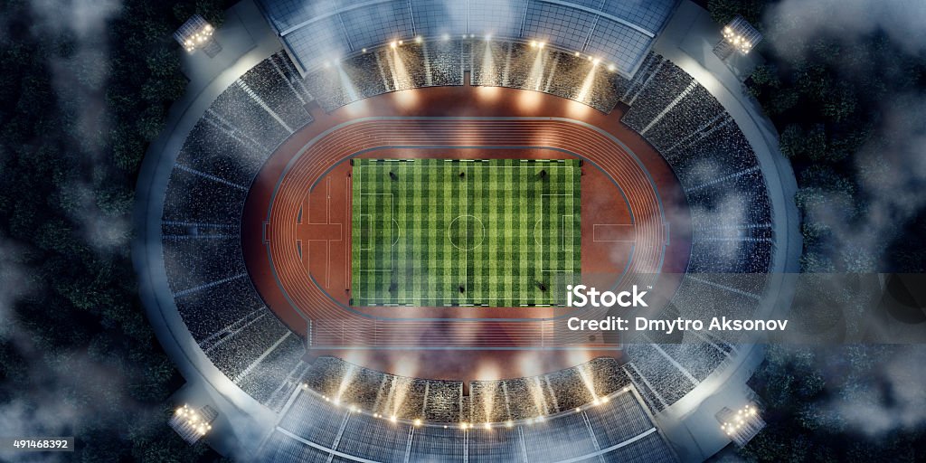 . stadium with running tracks Bird view of . sport stadium with crowds of people at evening. The image was made in 3d. Stadium Stock Photo