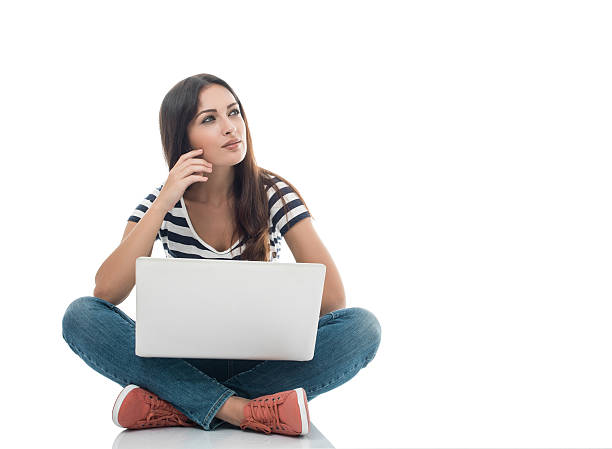 istock Young woman with laptop on white 491468406