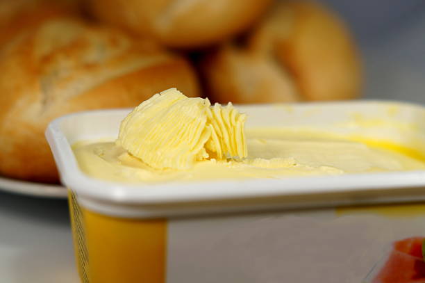 Rolls and margarine Fresh bread rolls for breakfast margarine stock pictures, royalty-free photos & images
