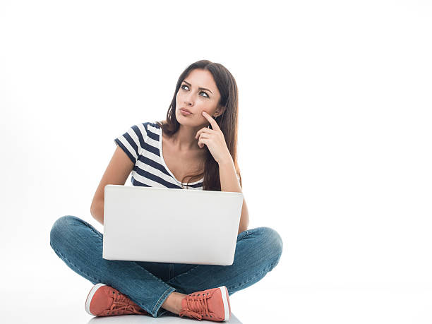 istock Young woman with laptop on white 491468434
