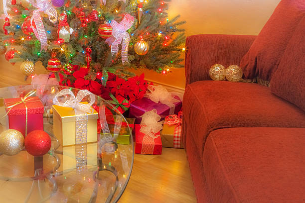 istock Christmas Tree, lights,gifts, and coffee table in day (P) 491469214