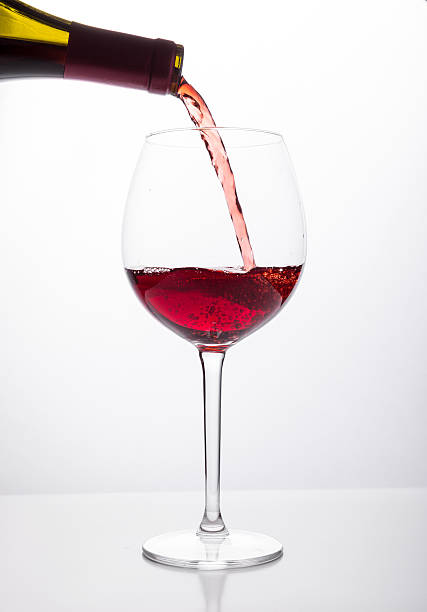 istock Red wine being poured into glass 491469542
