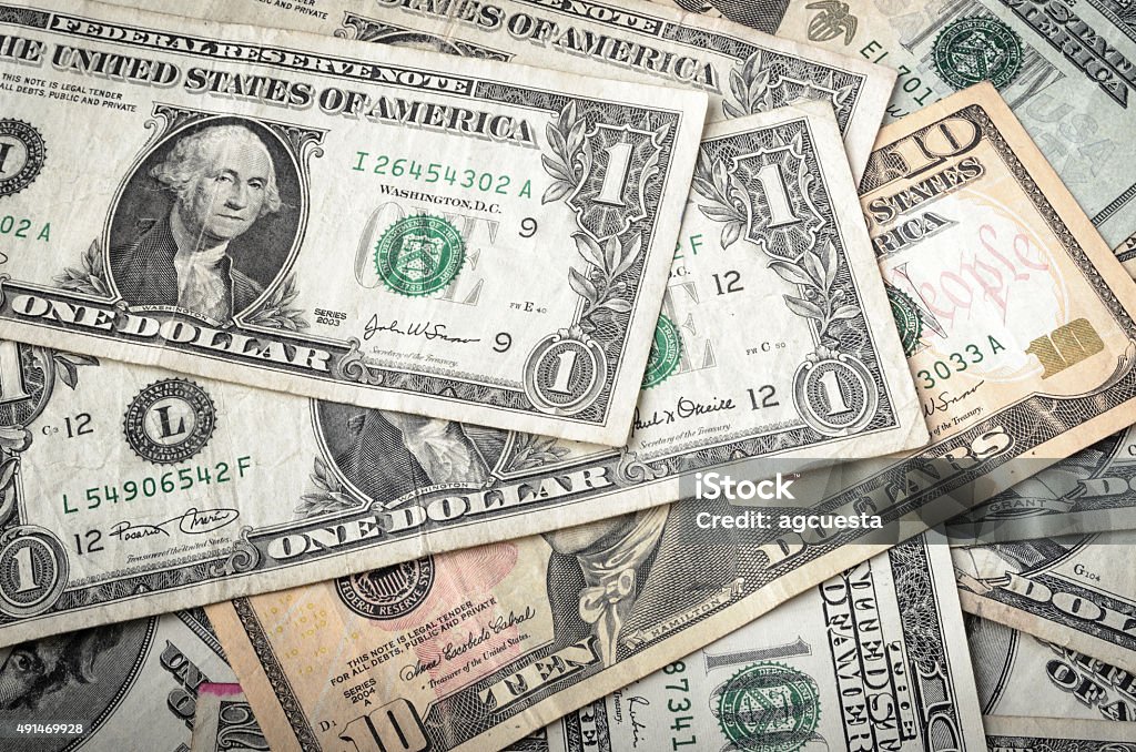 Dollar Bills Dollars assorted bills, cash pile background US Currency Stock Photo