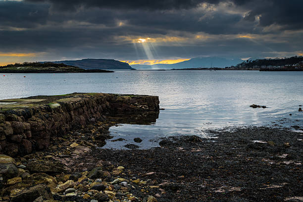Photo was taken on the Isle of Cumbrae, at millport as sun was breaking through the clouds viewing from the harbour.