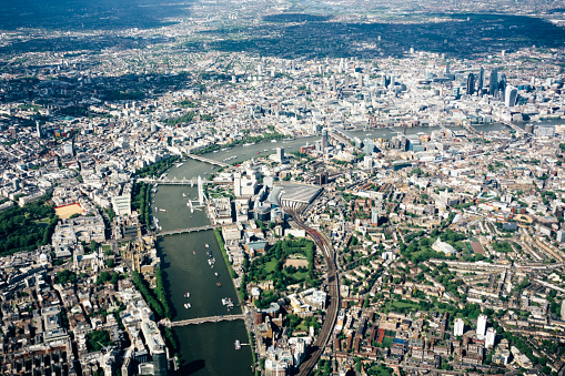 Scenic aerial view of London, over the river Thames towards Canary Wharf and Eastern London