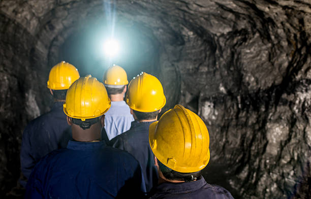 istock Group of men working in an underground mine 491471576