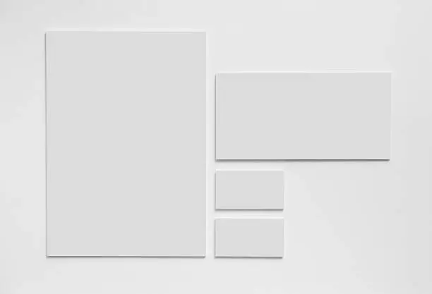 Gray simple stationery mock-up template on white background. Envelope, business cards and A4 paper.