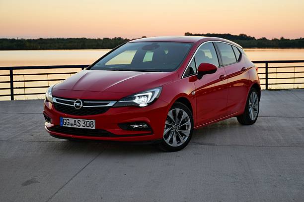 Bratislava, Slovakia - 1st October, 2015: Opel Astra cars stopped on the parking during the press launch. The first generation of Astra was debut in 1991 on the market. This model is the most popular car from Opel on the European market.