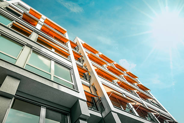 istock modern residential house with orange awnings in Berlin 491486894