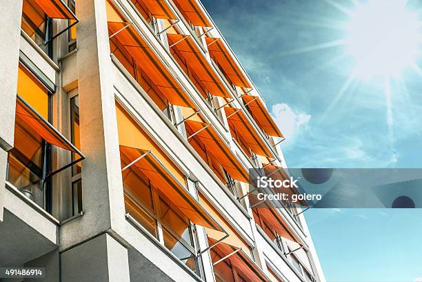 Modern Residential House With Orange Awnings In Sunny Berlin Stock Photo - Download Image Now