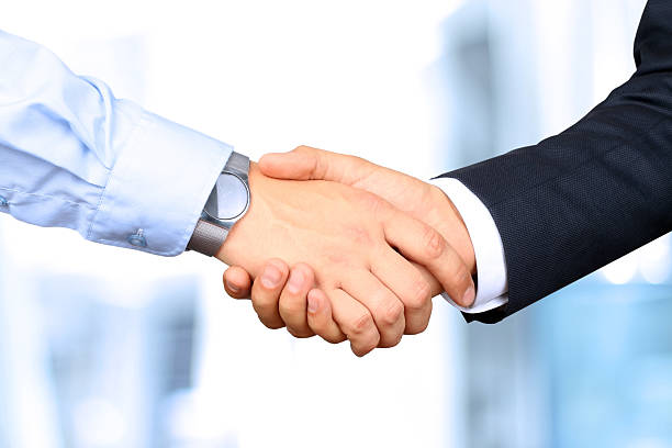 istock The firm handshake  between two colleagues 491488174