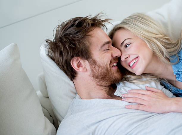istock Young couple relaxing at home 491495702