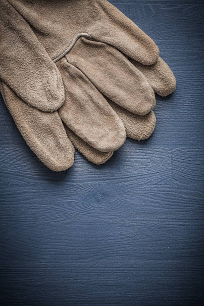 istock two safety gloves on blue board 491500678