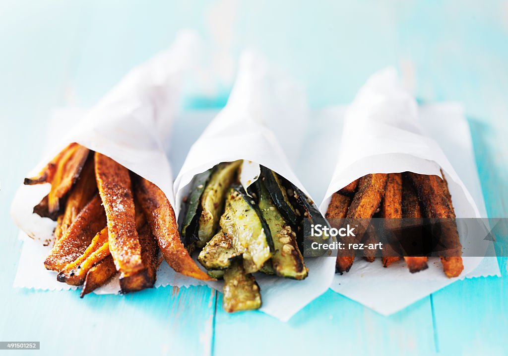 trio of carrot, zucchini, and sweet potato fries trio of carrot, zucchini, and sweet potato fries shot head on French Fries Stock Photo