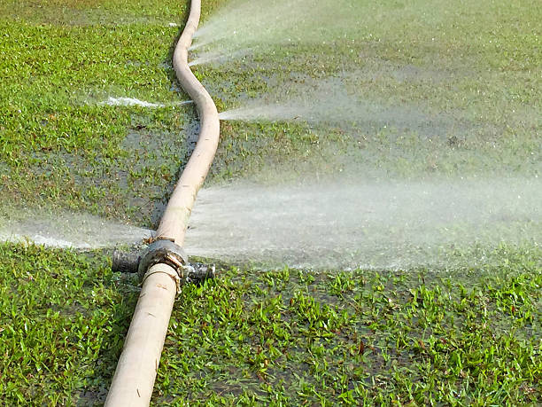 istock water leaking from hole in a hose 491501686