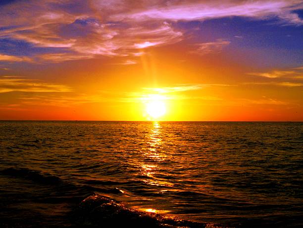 istock sunset at the beach ocean panorama 491502214