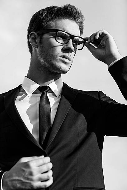 istock handsome man wearing suit and tie 491511168