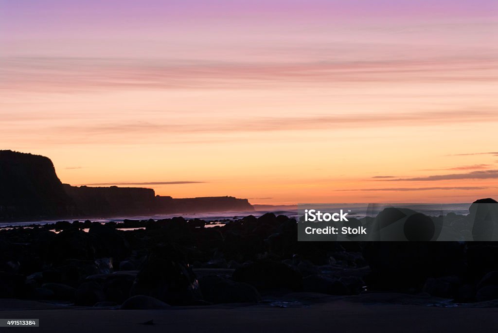 Light sunrise A beachscape image from Taranaki, New Zealand 2015 Stock Photo