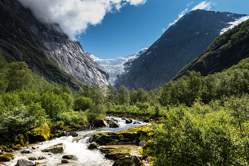 The Briksdalsbreen glacier or Briksdal glacier,  is one of the most accessible and best known arms of the Jostedalsbreen glacier. Briksdalsbreen is located in the municipality of Stryn in Sogn og Fjordane county, Norway. The glacier lies on the north side of the Jostedalsbreen, in Briksdalen (the Briks valley) which is located at the end of the Oldedalen valley, about 25 kilometres (16 mi) south of the village of Olden. It is located inside Jostedalsbreen National Park. Briksdalsbreen terminates in a small glacial lake, Briksdalsbrevatnet, which lies 346 metres (1,135 ft) above sea level.