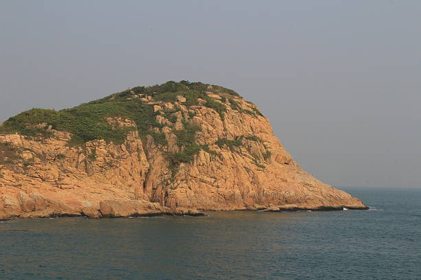 istock rocky sea coast and blurred water in shek o 491514810