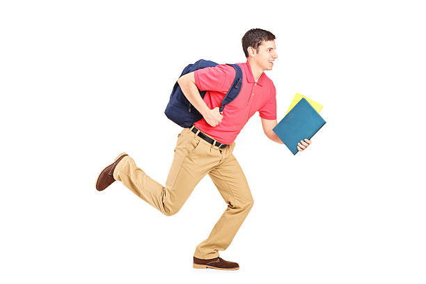 istock Male student holding books and running 491517187
