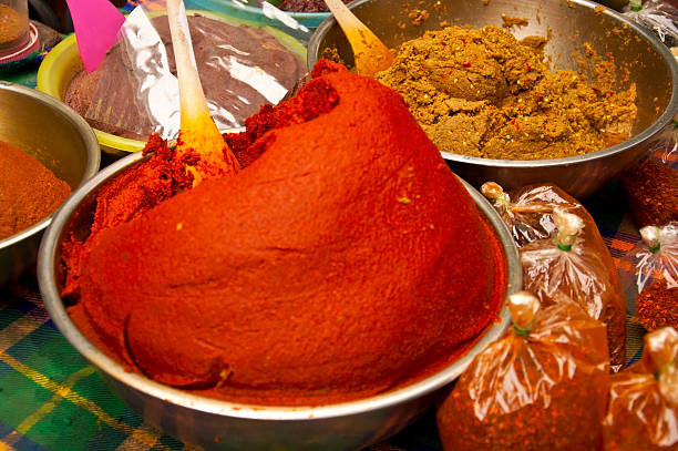istock Hot Chilli Chillies pepper, whole and crushed in big bowl 491517479