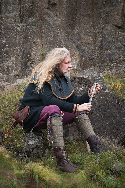 istock Blond male cleans his knife 491517572