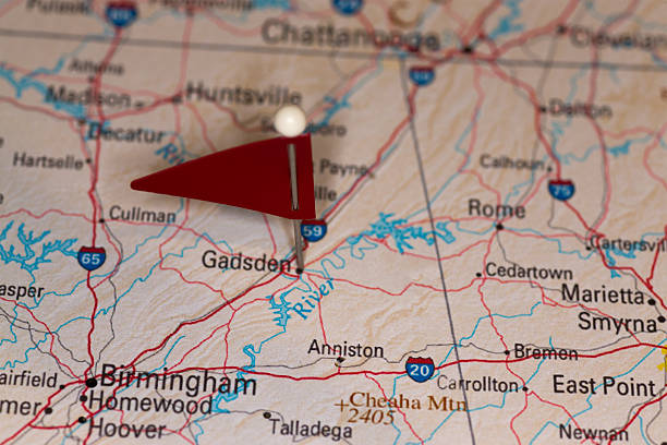 Gadsden, AL, USA - Cities on Map Series A map pin with a red flag pinpoints the city on a select area from a high quality map.  The red flag creates highlighted copy space for text. map of alabama cities stock pictures, royalty-free photos & images