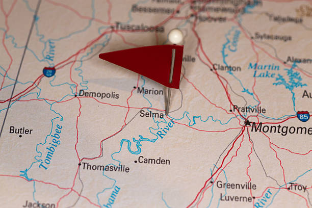 Selma, AL, USA - Cities on Map Series A map pin with a red flag pinpoints the city on a select area from a high quality map.  The red flag creates highlighted copy space for text. alabama map of cities stock pictures, royalty-free photos & images