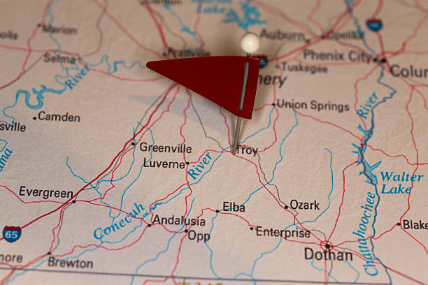 Troy, AL, USA - Cities on Map Series A map pin with a red flag pinpoints the city on a select area from a high quality map.  The red flag creates highlighted copy space for text. alabama state map with cities stock pictures, royalty-free photos & images
