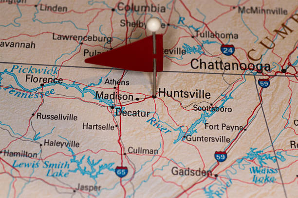 Huntsville, AL, USA - Cities on Map Series A map pin with a red flag pinpoints the city on a select area from a high quality map.  The red flag creates highlighted copy space for text. map of alabama cities stock pictures, royalty-free photos & images