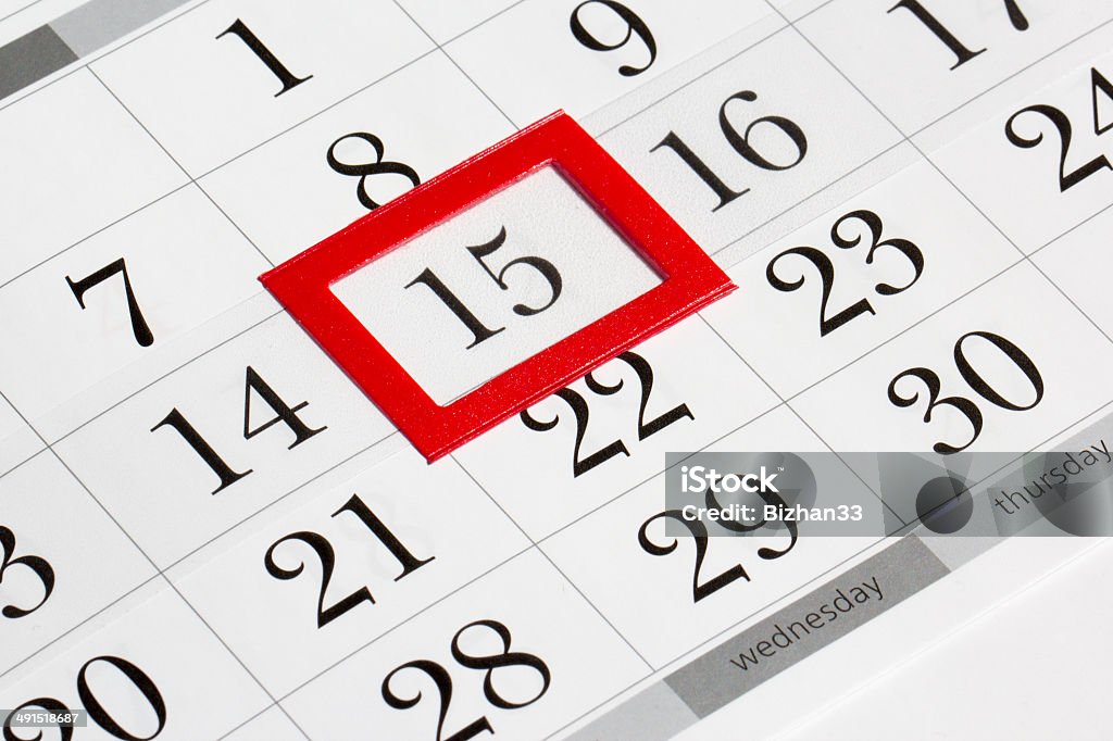 Calendar page with selected middle date of month Calendar page with marked date of 15th Annual Event Stock Photo