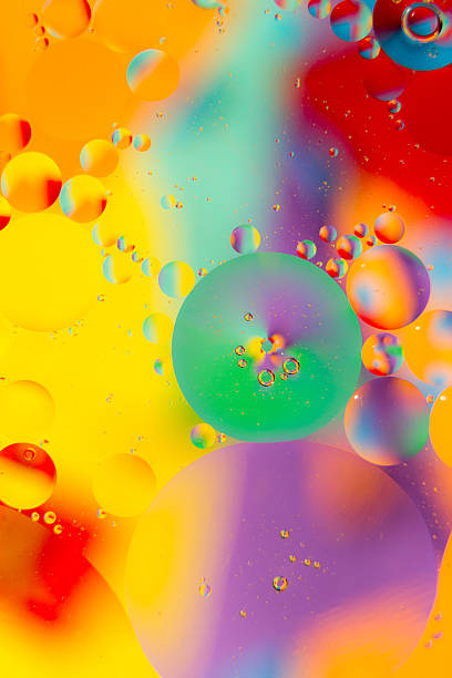 istock Oil drops in water on a coloured background 491519425