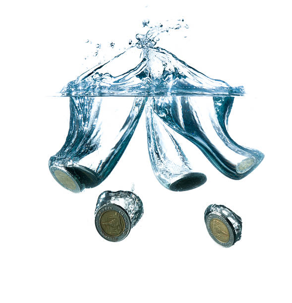 istock money in water with bubbles on white background 491520649